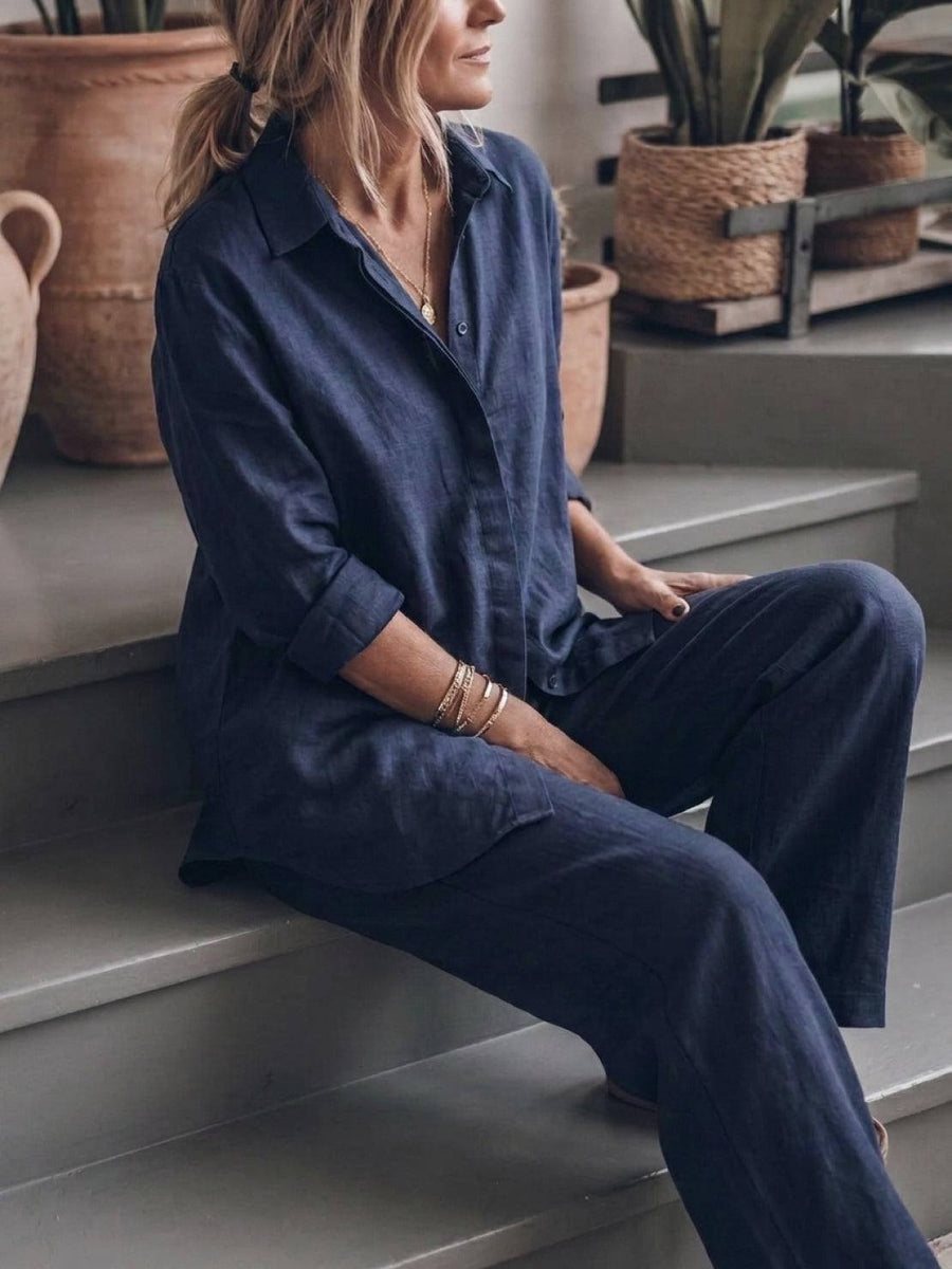Woman sitting comfortably in a navy blue cotton shirt and wide-leg pants set
